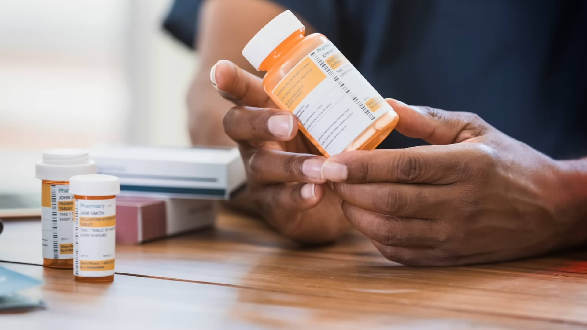 Man holding an antidepressant that can affect his brain function